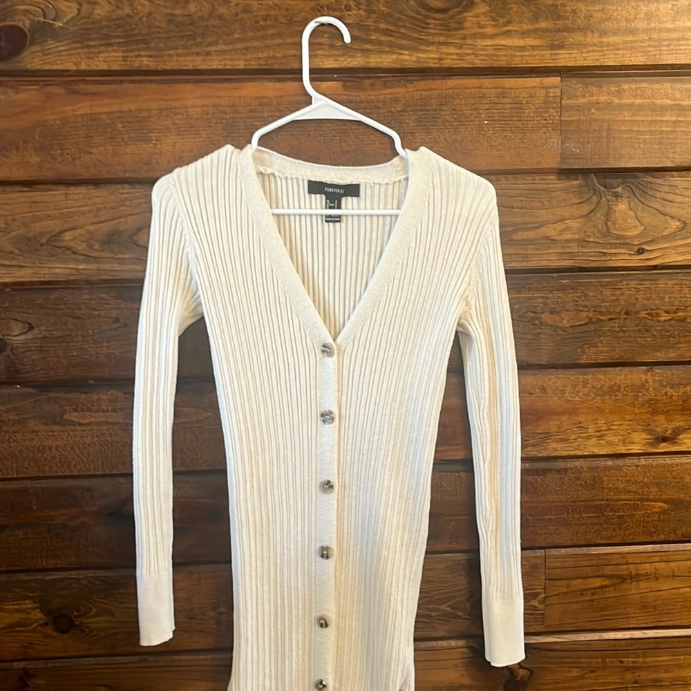 cream colored long sleeve dresss with slits